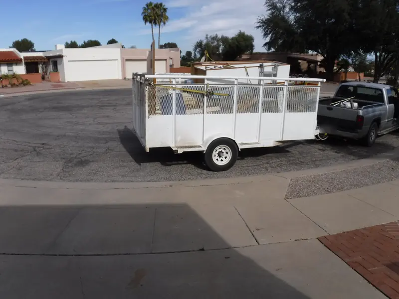 Junk removal after: the curb cleared and the load on the trailer
