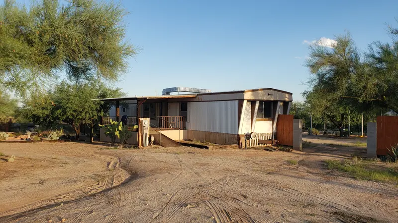 Mobile home demolition in Three Points, AZ, before: the old mobile home on the lot