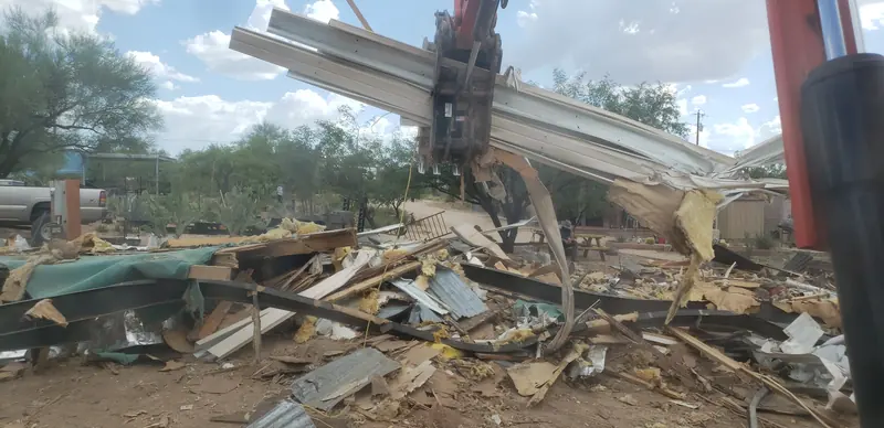 Mobile home demolition in Three Points, AZ, during: tearing the mobile home down