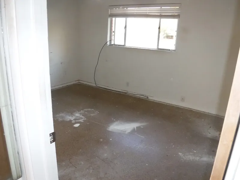 REO trash out, after: the second bedroom emptied to the bare floor